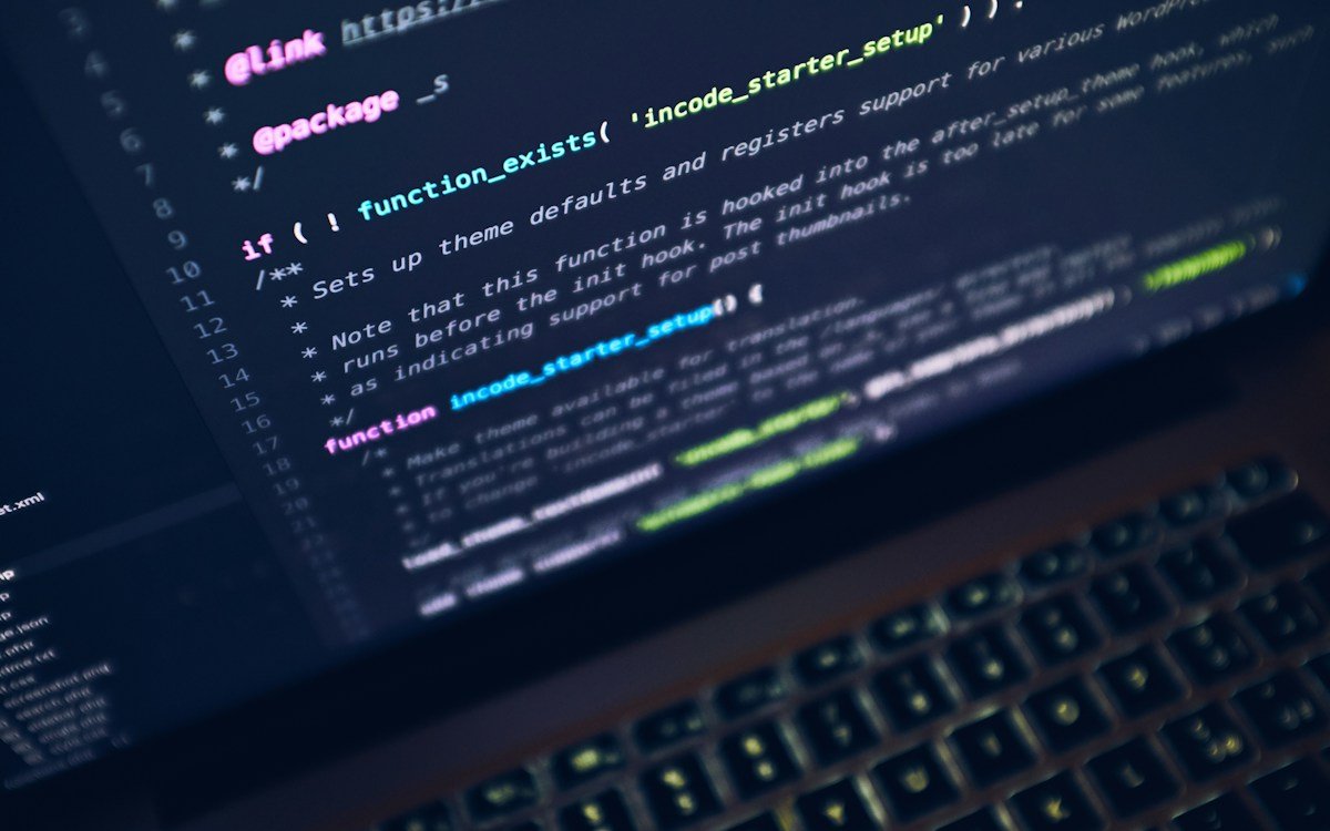 Application source code displayed on a laptop screen